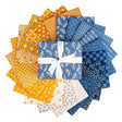 Denim & Daisy fat quarters by Lori Holt fanned out – daisy florals, plaids and text prints in blue and gold