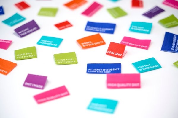 Oh Shoot woven labels pack showing all 8 label designs